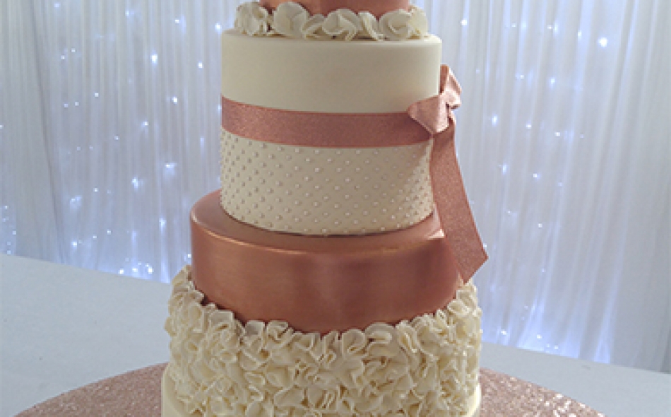 4 Tier Rose Gold & Ivory Ruffle Wedding Cake From £595